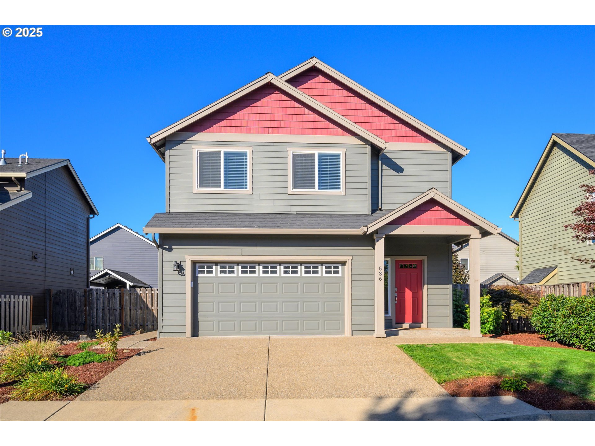 a view of house with backyard