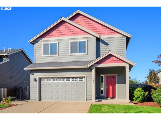 a front view of a house with yard
