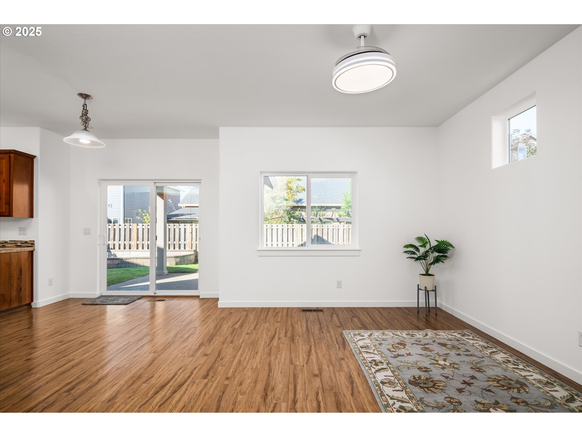 536 Raber Road Eugene, OR 97402 - Photo 7 of 41 a view of an empty room with wooden floor and a window