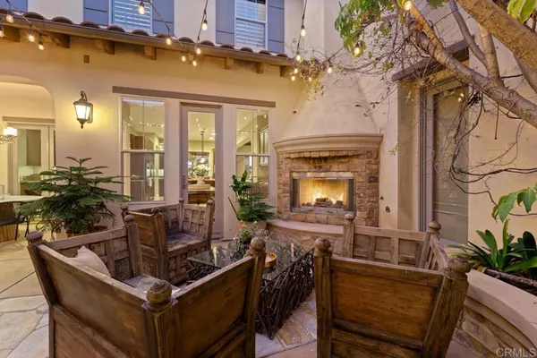 a view of a dining room with furniture and chandelier