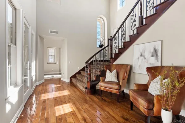a kitchen with a stove a kitchen island a table and chairs
