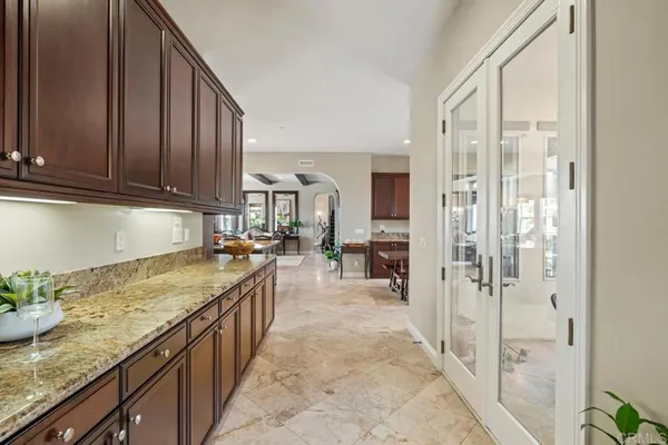 a living room with fireplace furniture and a large window