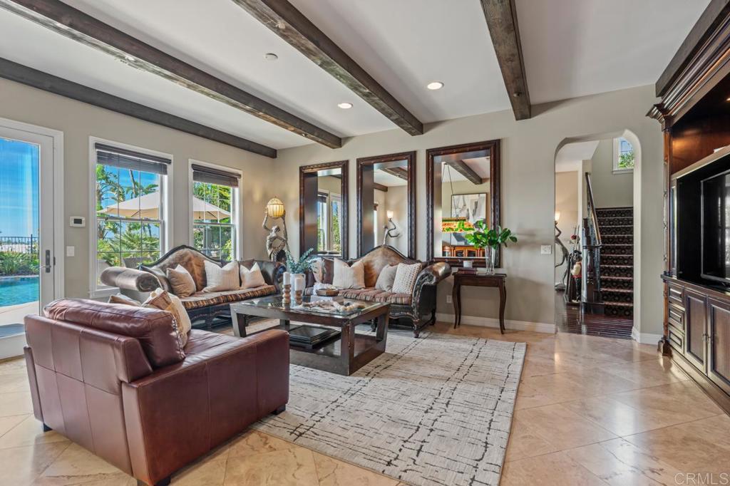 14844 Whispering Ridge Road San Diego, CA 92131 - Photo 29 of 73 a living room with furniture and a flat screen tv
