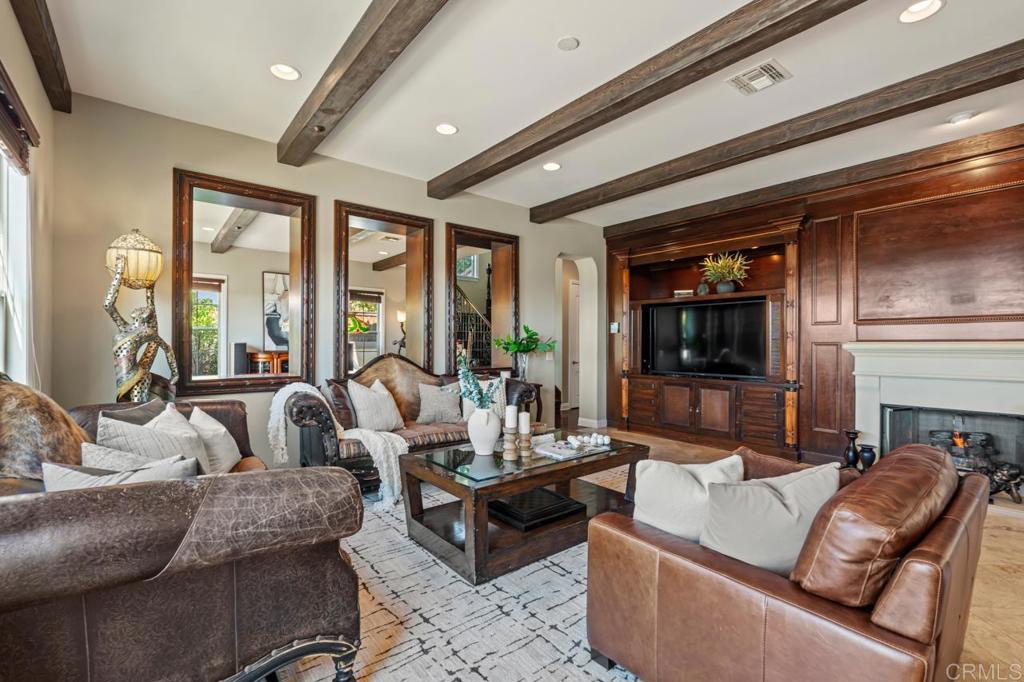 14844 Whispering Ridge Road San Diego, CA 92131 - Photo 30 of 73 a living room with fireplace furniture and a large window