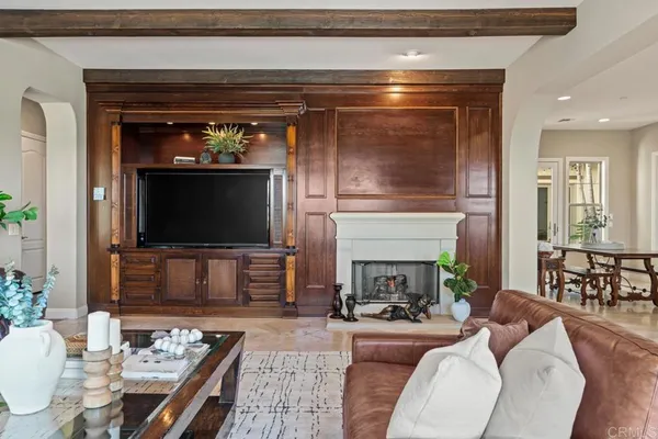 a view of swimming pool with lawn chairs and a patio