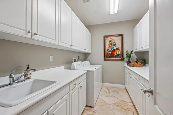 a spacious bathroom with a tub and a sink