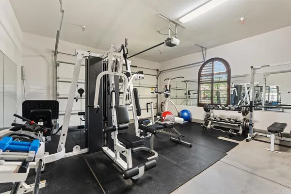 a bathroom with a tub and a window
