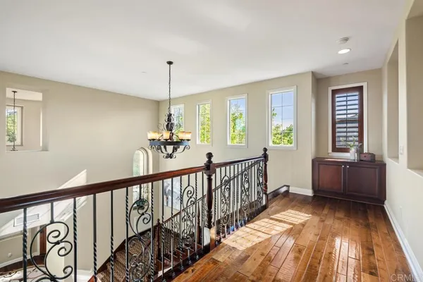 a bathroom with a sink a toilet a mirror and shower