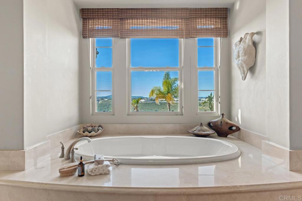 14844 Whispering Ridge Road San Diego, CA 92131 - Photo 56 of 73 a bathroom with a tub and a window