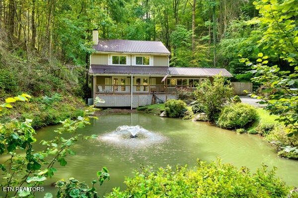 3127 Emerald Springs Loop Sevierville, TN 37862 - Photo 2 of 60 a view of a house with a yard