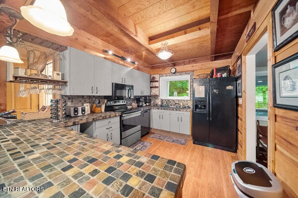 3127 Emerald Springs Loop Sevierville, TN 37862 - Photo 21 of 60 a kitchen with stainless steel appliances granite countertop a refrigerator a stove a sink and dishwasher