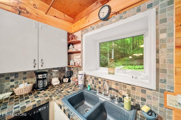 3127 Emerald Springs Loop Sevierville, TN 37862 - Photo 25 of 60 a kitchen with a stove a sink and a window