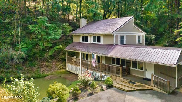 3127 Emerald Springs Loop Sevierville, TN 37862 - Photo 3 of 60 a view of a house with a yard