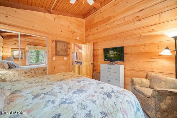 3127 Emerald Springs Loop Sevierville, TN 37862 - Photo 44 of 60 a bedroom with a bed and a flat screen tv