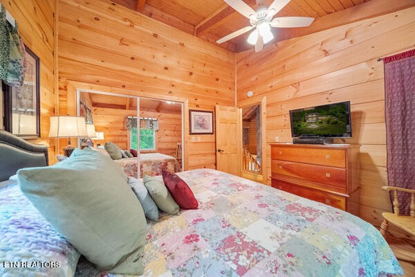 3127 Emerald Springs Loop Sevierville, TN 37862 - Photo 47 of 60 a bedroom with a bed and a flat screen tv