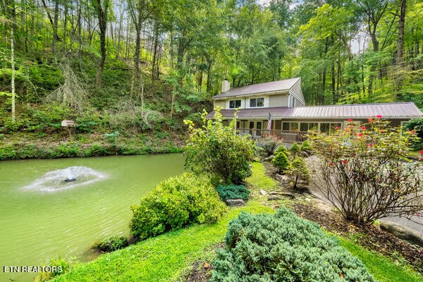 3127 Emerald Springs Loop Sevierville, TN 37862 - Photo 6 of 60 a house with swimming pool in front of it