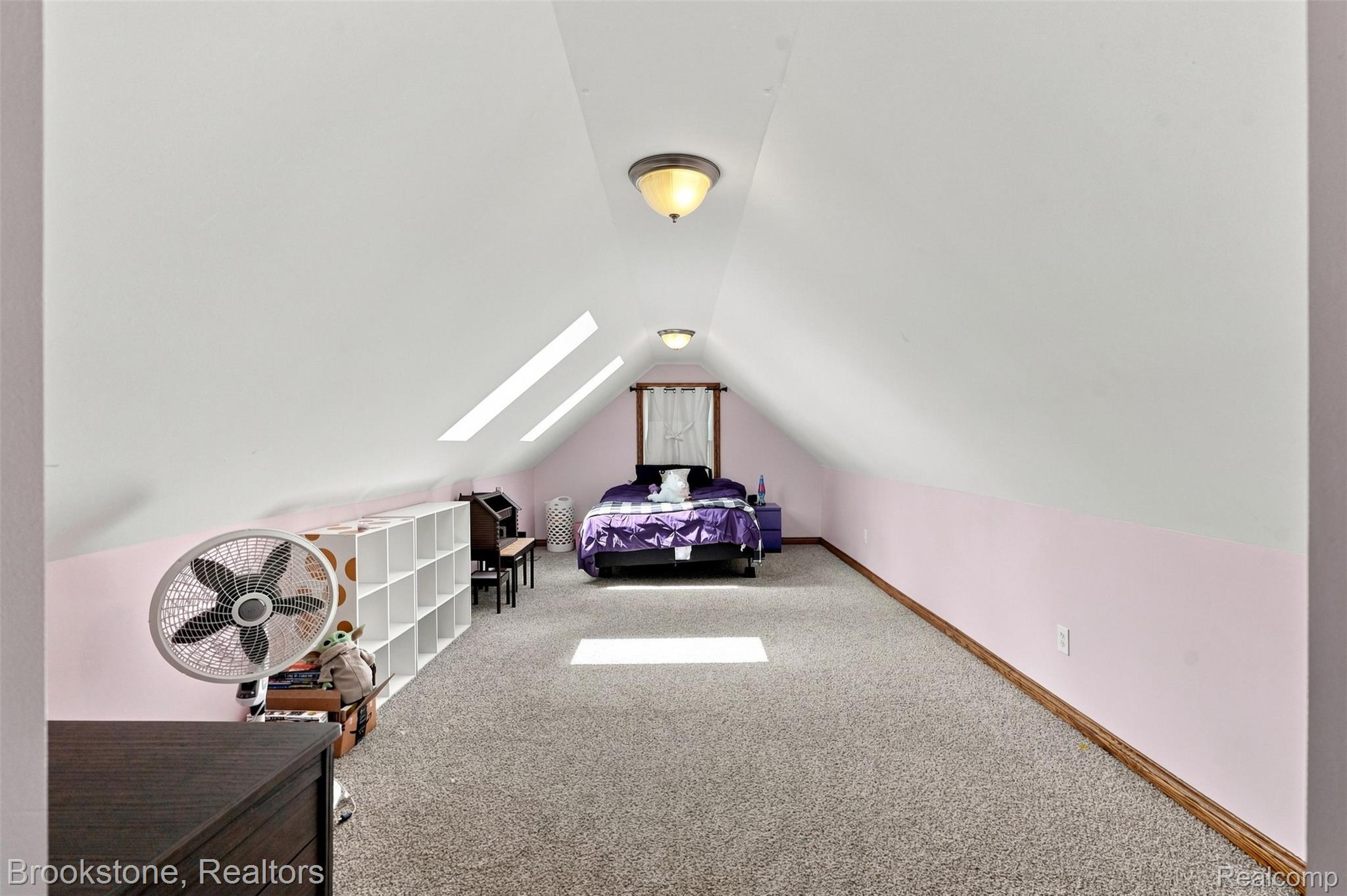 1775 Dutcher Road Howell, MI 48843 - Photo 23 of 41 Sloped ceiling attic space with skylights, flush mount lighting fixtures, and carpet flooring