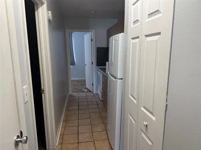 a kitchen with a stove and a refrigerator