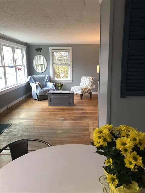 14 Bayberry Road Bourne, MA 02532 - Photo 5 of 16 a living room with furniture and a large window