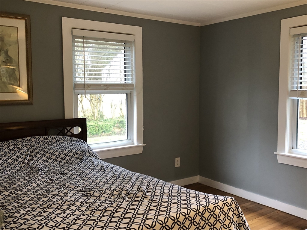 14 Bayberry Road Bourne, MA 02532 - Photo 8 of 16 a bedroom with a bed and a window