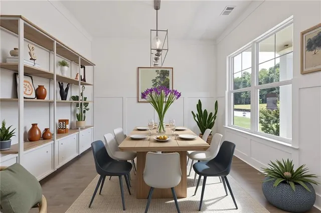 a view of a dining room with furniture and window