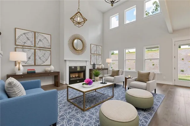 a living room with fireplace furniture and a wooden floor