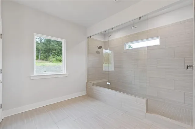a bathroom with a shower and a tub