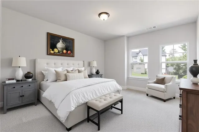 a bedroom with bed and a couch