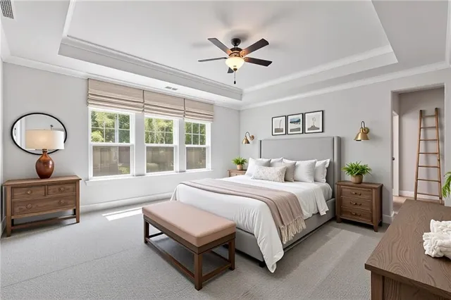 a spacious bedroom with a bed a chandelier and a large window