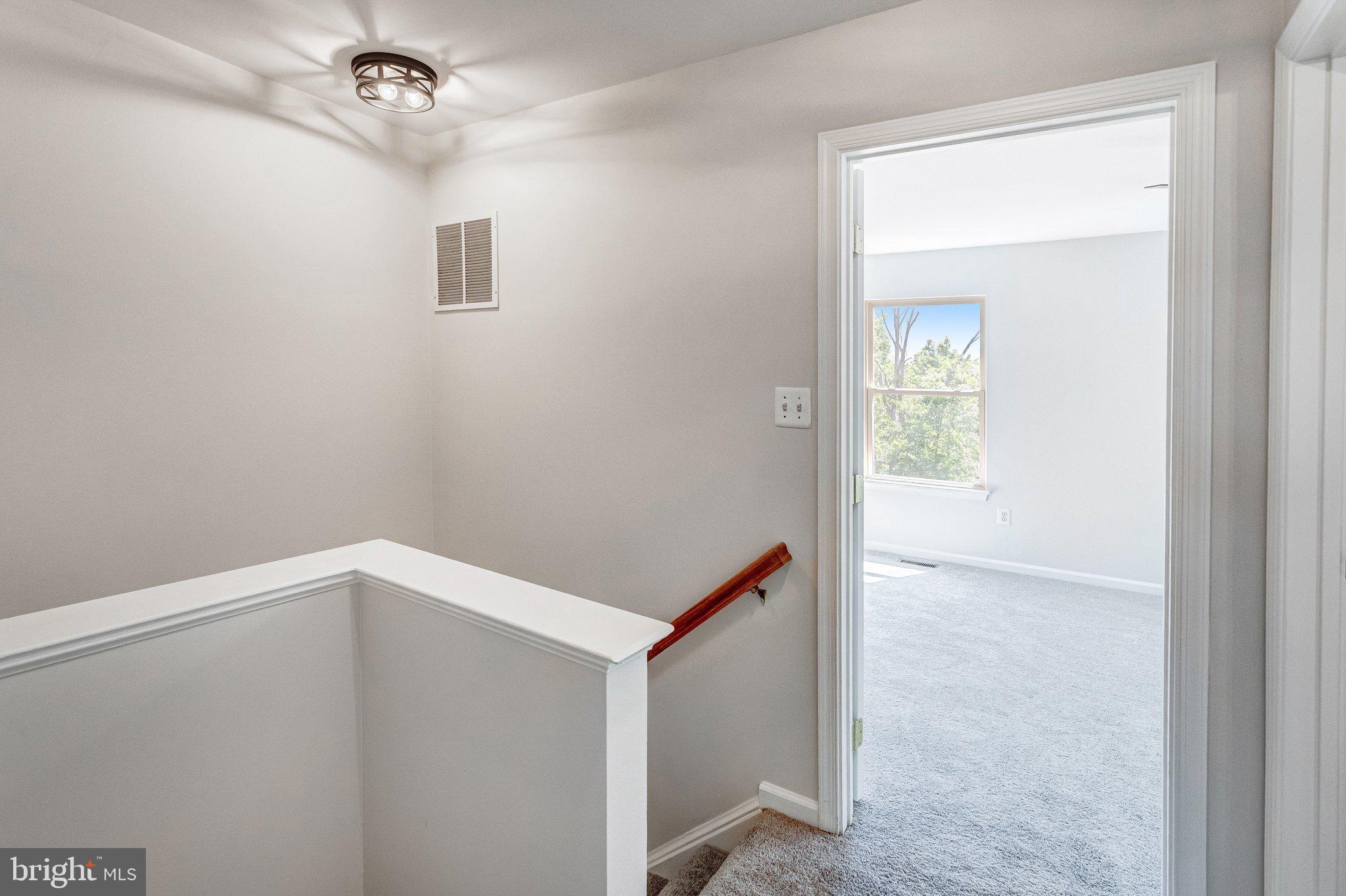 6489 McCoy Road Centreville, VA 20121 - Photo 13 of 34 Bright and inviting upper landing space.
