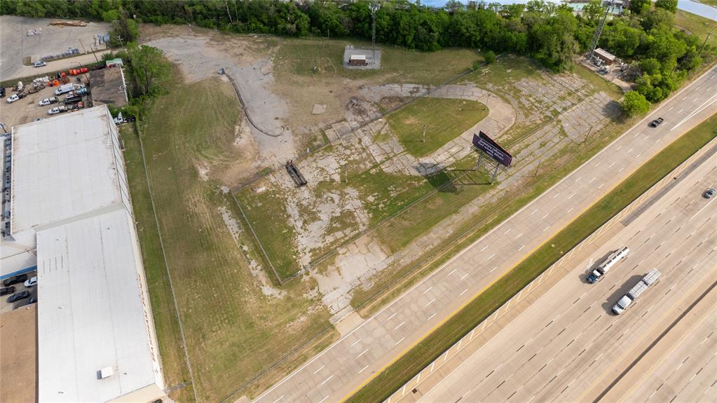 600 Southwest Loop 820 Fort Worth, TX 76115 - Photo 23 of 31 a view of a swimming pool with a yard
