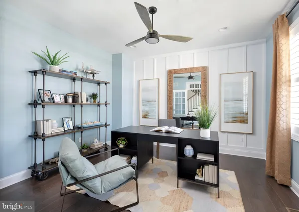 a room with a table chairs and wooden floor