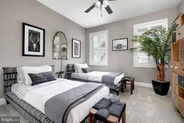 a bedroom with furniture and a window
