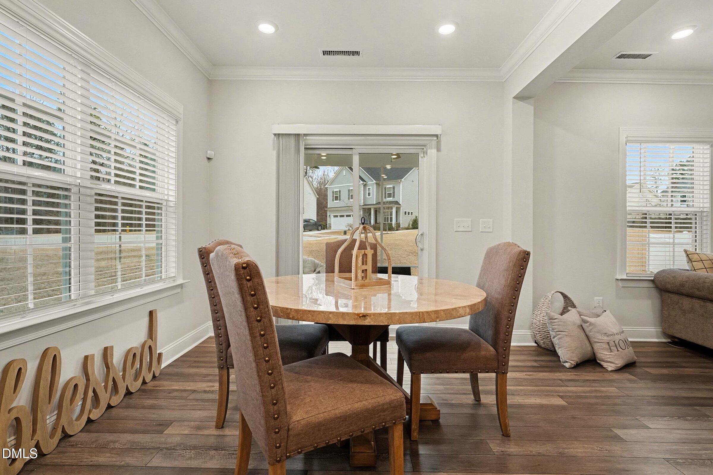 183 Axis Deer Lane Garner, NC 27529 - Photo 14 of 35 a dining room with furniture window wooden floor