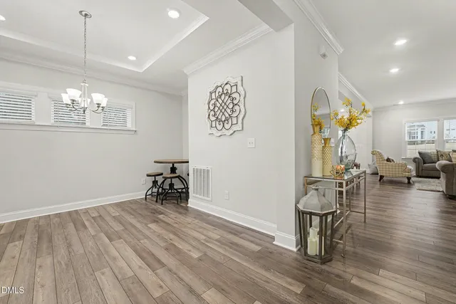 a view of livingroom with dining room and wooden floor