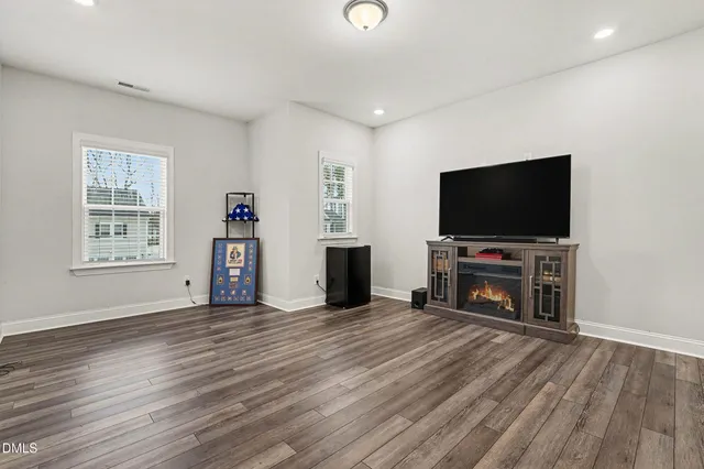 a view of a livingroom with furniture and a flat screen tv