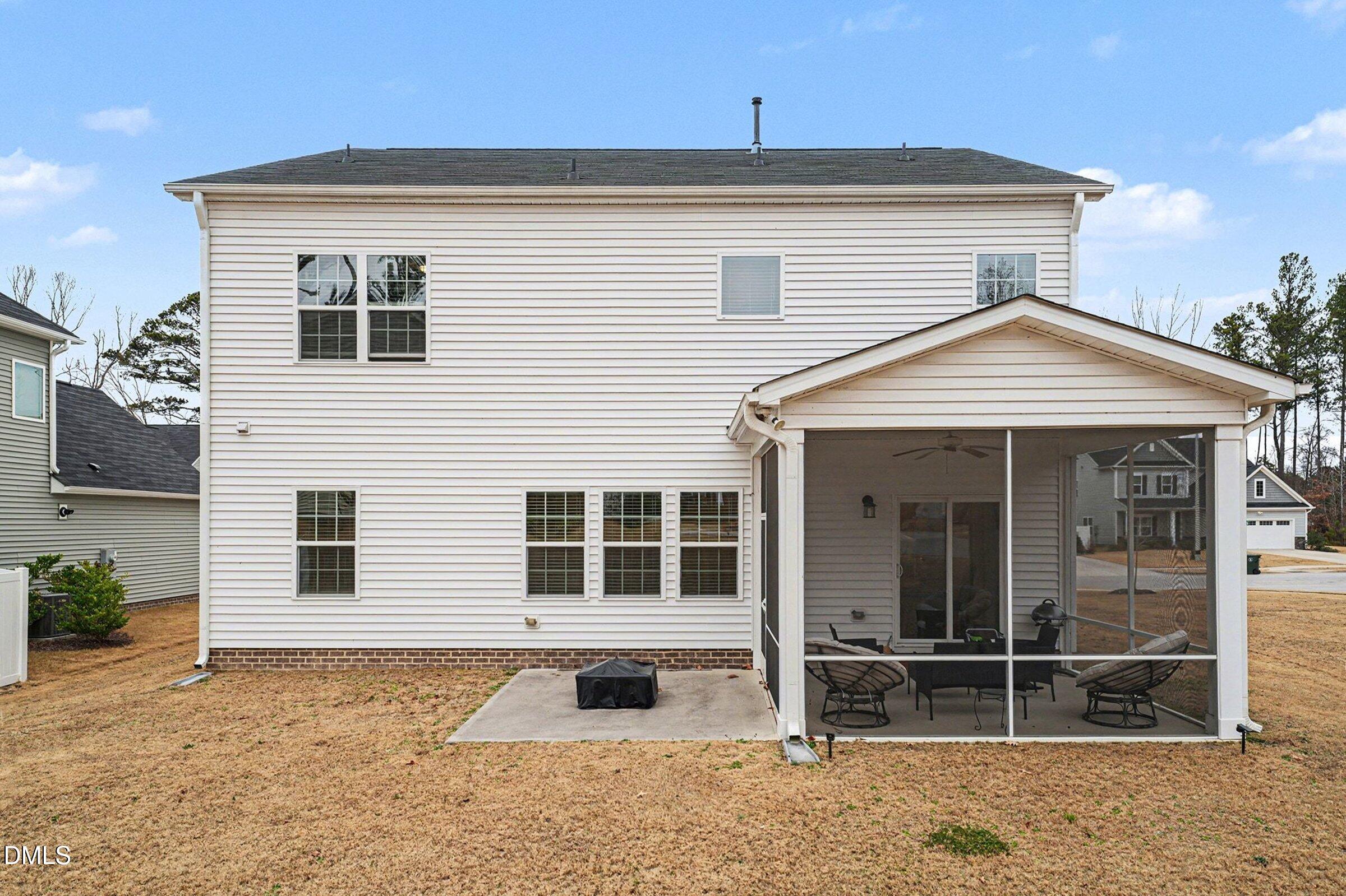 183 Axis Deer Lane Garner, NC 27529 - Photo 32 of 35 a front view of a house with a large window and a yard