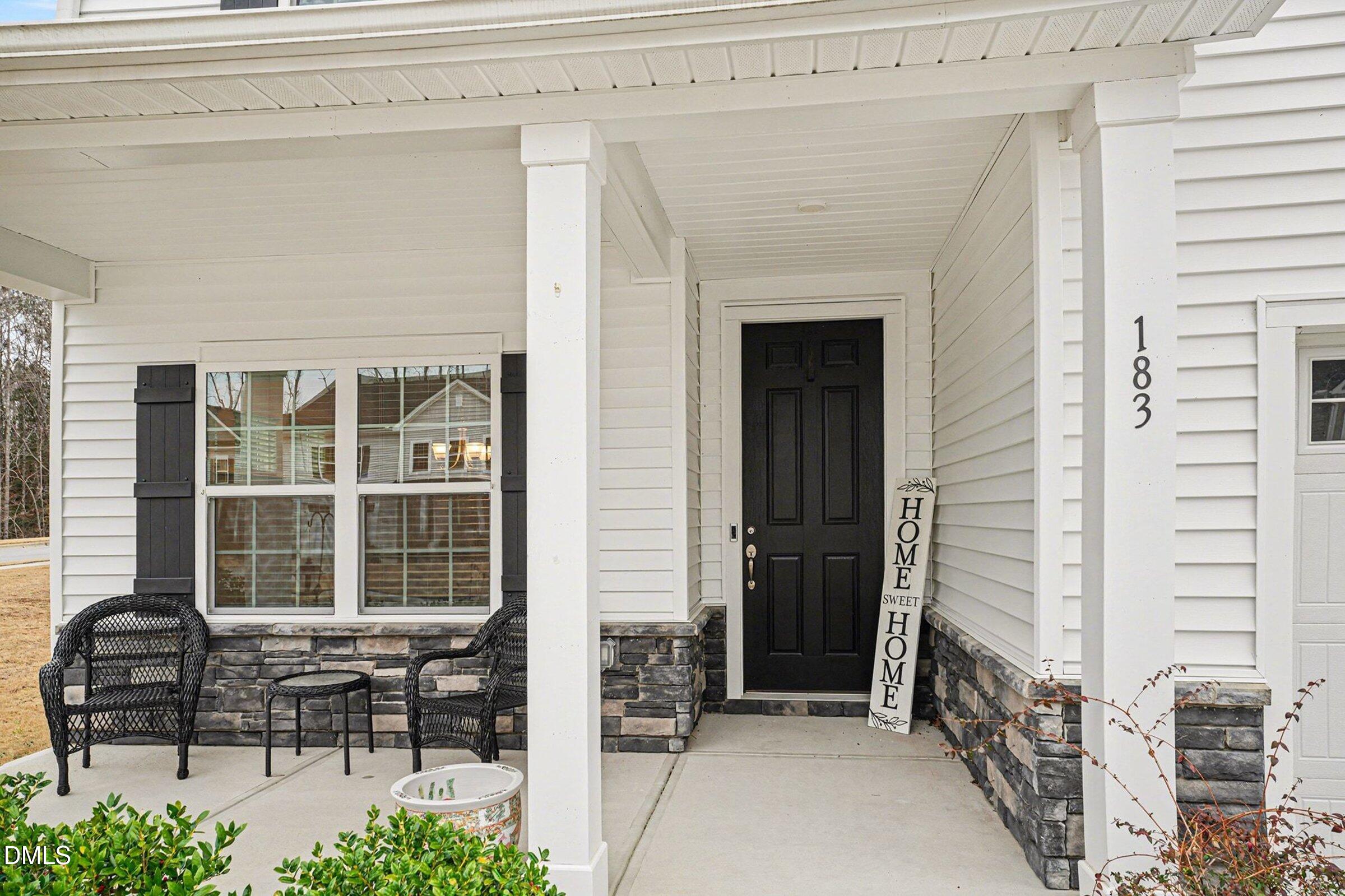 183 Axis Deer Lane Garner, NC 27529 - Photo 4 of 35 a porch with outdoor seating