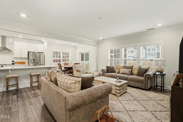 a living room with furniture and a table