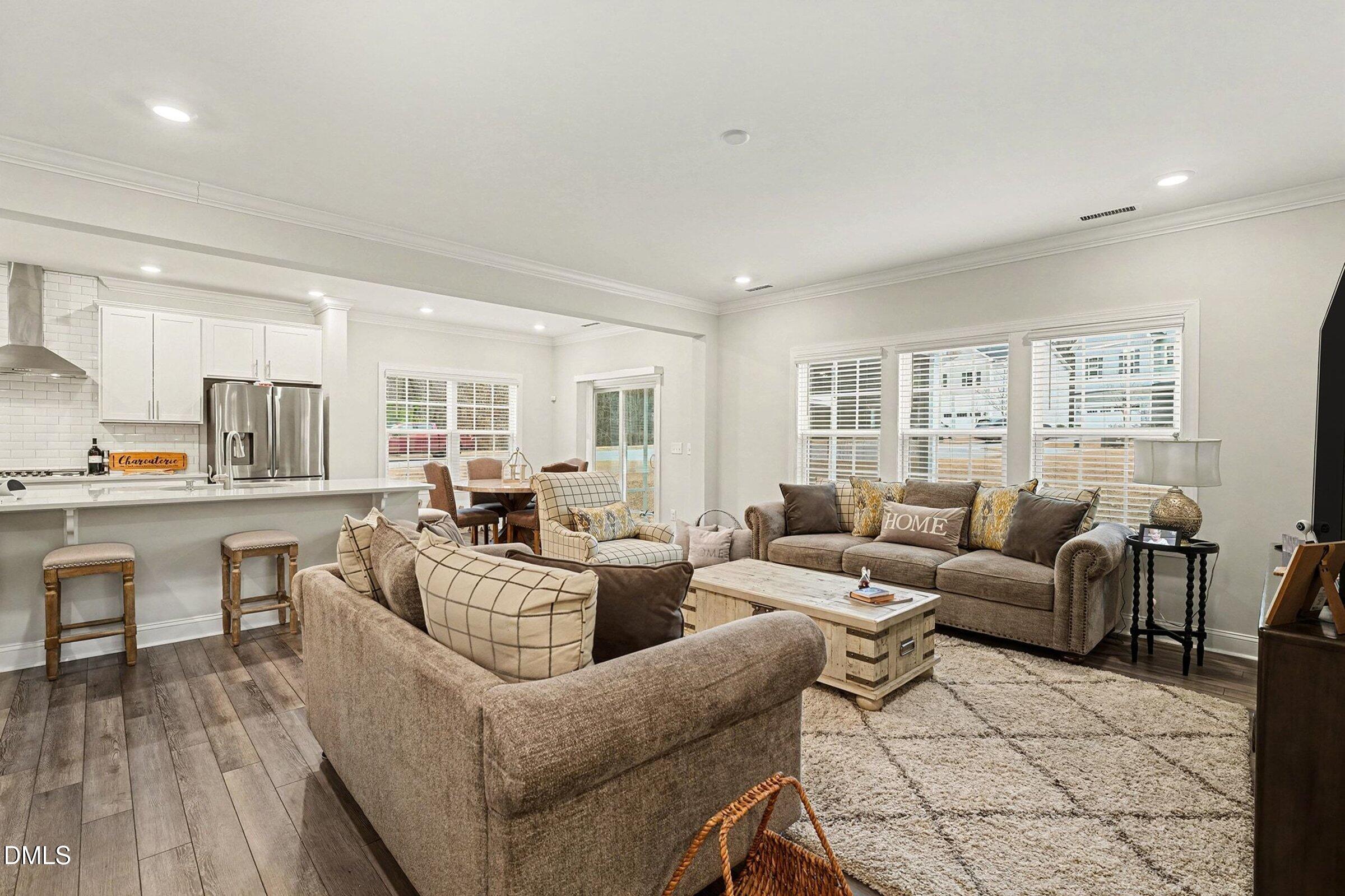 183 Axis Deer Lane Garner, NC 27529 - Photo 7 of 35 a living room with furniture and a table