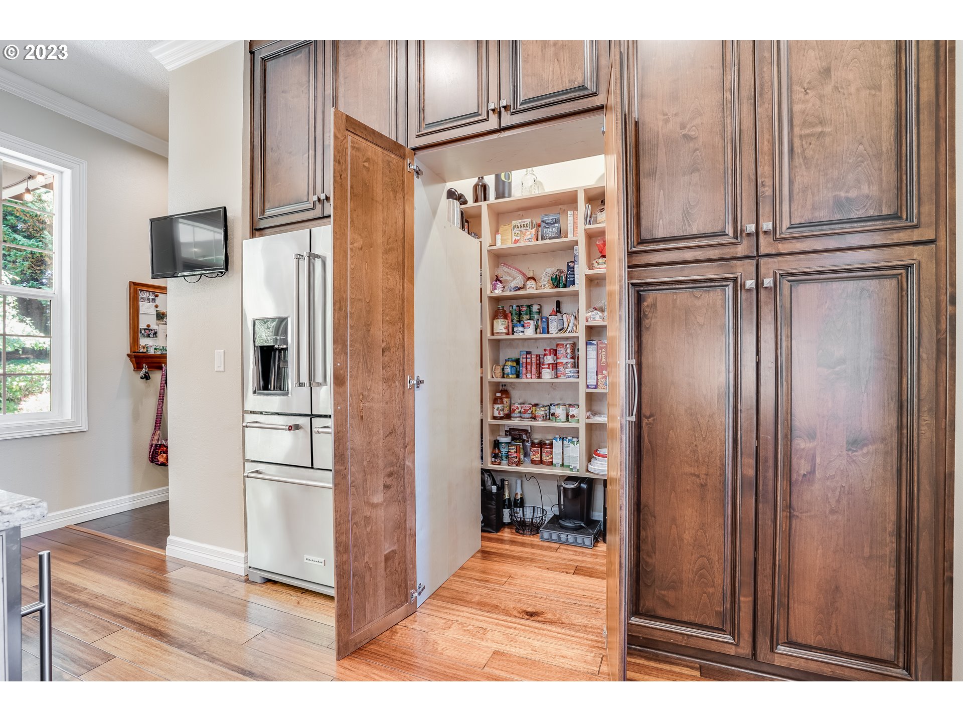 21418 Northwest 11th Avenue Ridgefield, WA 98642 - Photo 11 of 42 a view of kitchen with stainless steel appliances wooden floor and window