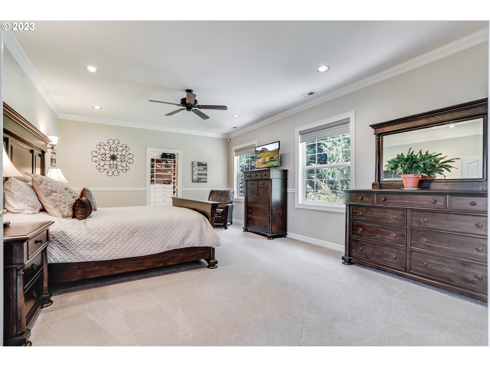 21418 Northwest 11th Avenue Ridgefield, WA 98642 - Photo 15 of 42 a spacious bedroom with a bed and a dresser