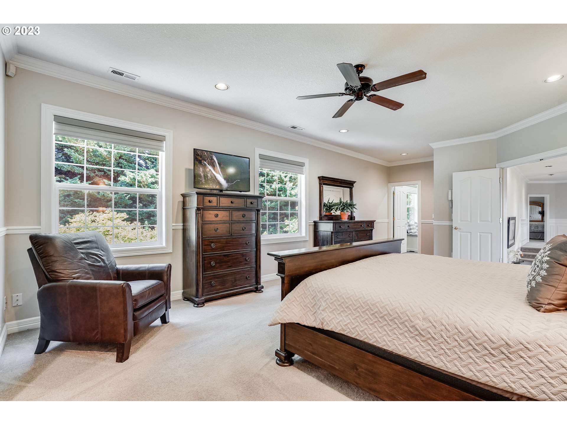 21418 Northwest 11th Avenue Ridgefield, WA 98642 - Photo 16 of 42 a bedroom with a bed and furniture