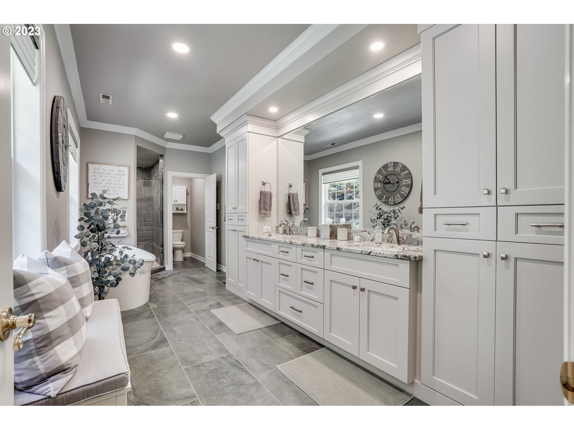 21418 Northwest 11th Avenue Ridgefield, WA 98642 - Photo 18 of 42 a bathroom with a sink mirror and a shower