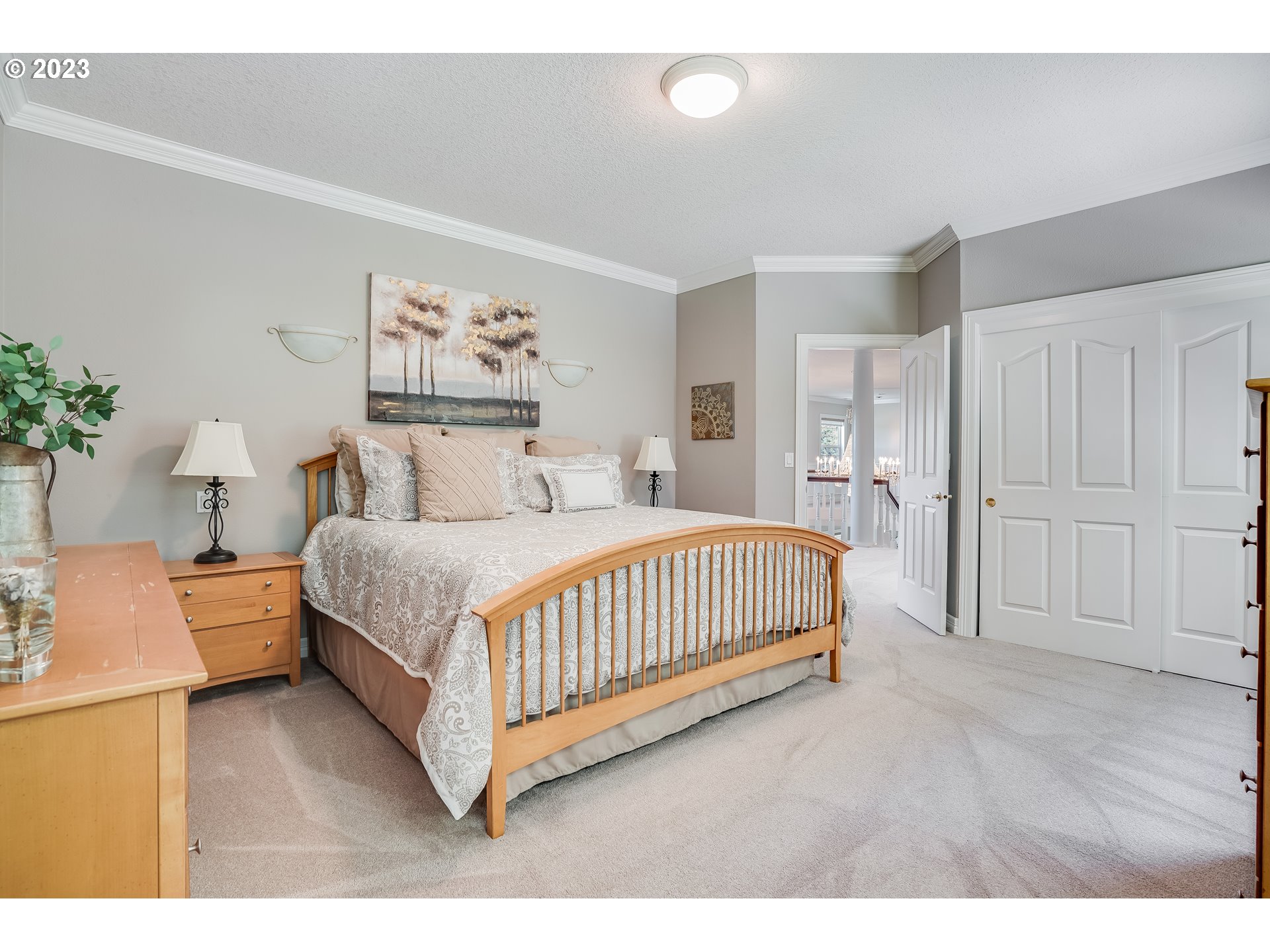 21418 Northwest 11th Avenue Ridgefield, WA 98642 - Photo 24 of 42 a bedroom with a bed and a painting on the wall