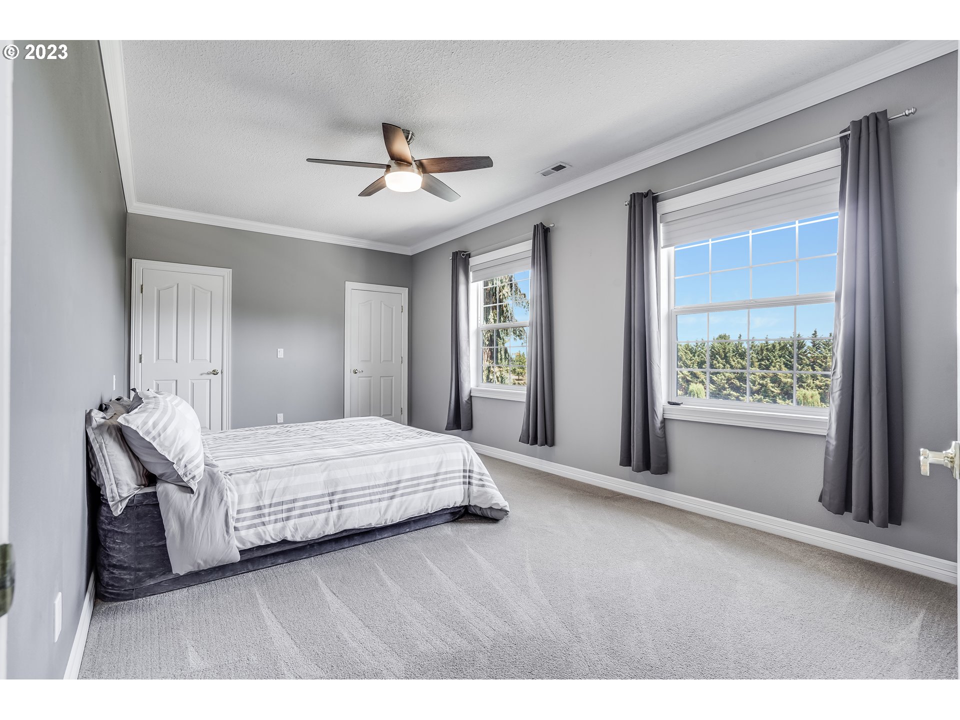 21418 Northwest 11th Avenue Ridgefield, WA 98642 - Photo 25 of 42 a living room with a bed furniture and a window