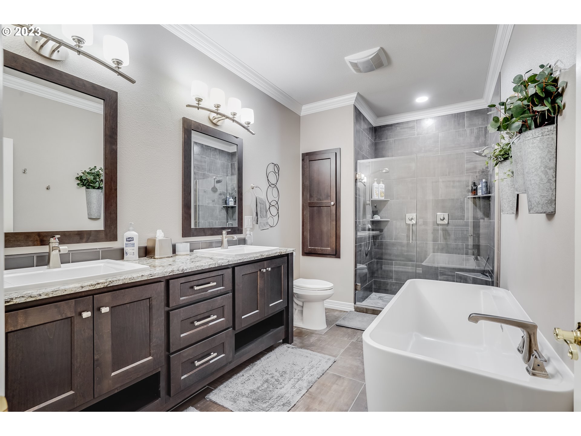 21418 Northwest 11th Avenue Ridgefield, WA 98642 - Photo 26 of 42 a bathroom with a sink a toilet and shower