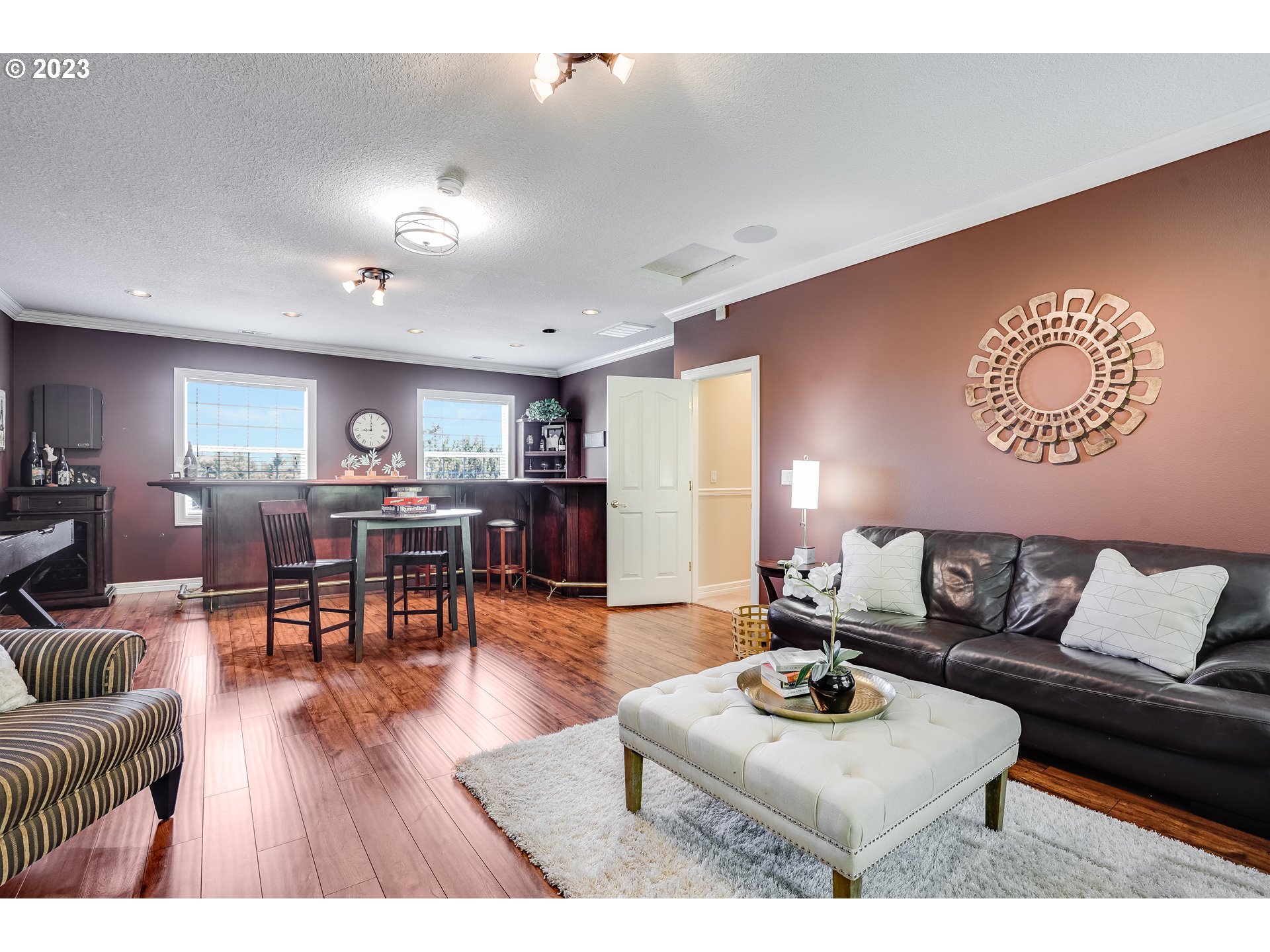 21418 Northwest 11th Avenue Ridgefield, WA 98642 - Photo 27 of 42 a living room with furniture and wooden floor