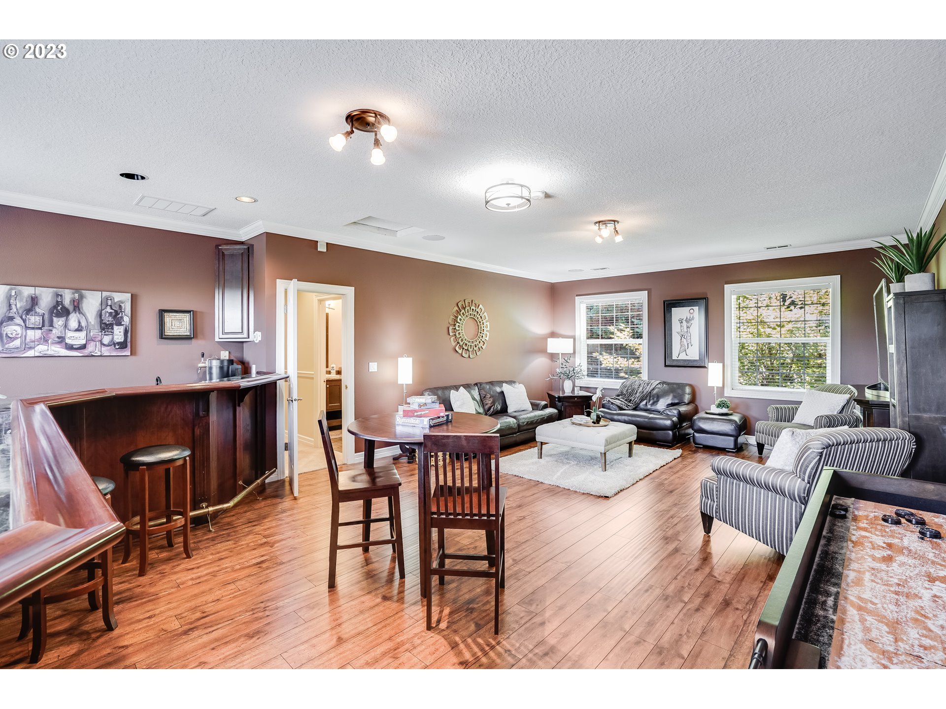 21418 Northwest 11th Avenue Ridgefield, WA 98642 - Photo 28 of 42 a living room with furniture wooden floor and a window