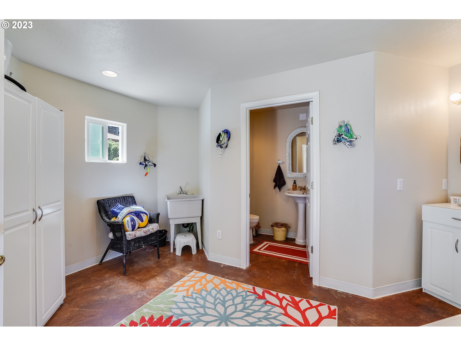 21418 Northwest 11th Avenue Ridgefield, WA 98642 - Photo 34 of 42 a living room with furniture and a wooden floor